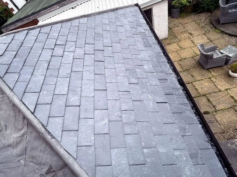 Finished natural slate re-roof on a rear extension